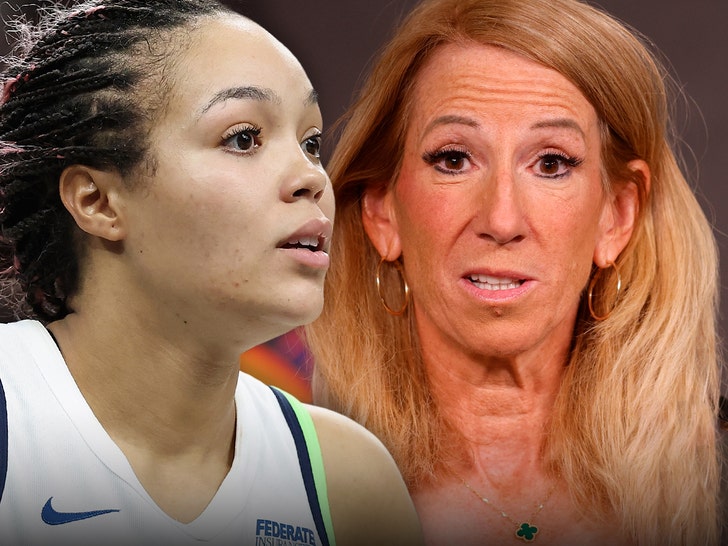 Napheesa Collier's looking concerned next to WNBA Commissioner Cathy Engelbert. The Former is wearing a white Nike basketball jersey.