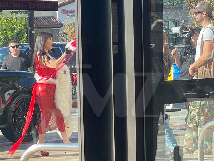 Kourtney Kardashian and her son on a commercial tmz wm