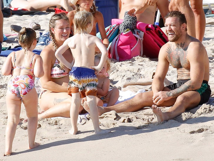 Conor McGregor Kisses Dee Devlin's Baby Bump During Beach Day With Family