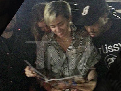 0702_Miley-and-Stella-Maxwell-hugging_wm