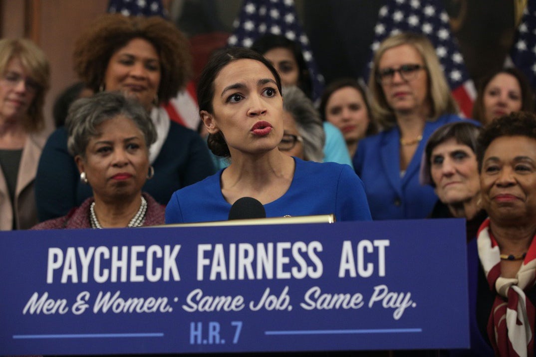 U.S. Rep. Alexandria Ocasio-Cortez (D-NY) (C) speaks as other House Democrats listen during a news conference at the U.S. Capitol January 30, 2019 in Washington, DC. House Democrats held a news conference to introduce the 