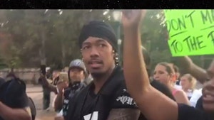 Nick Cannon Joins Protesters in St. Louis Wearing Colin Kaepernick Jersey