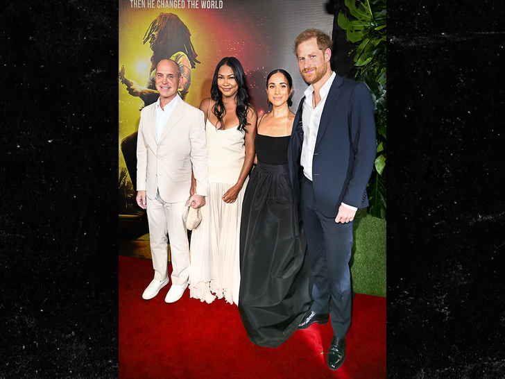 This is Prince Harry and Meghan Markle with Brian Robbins