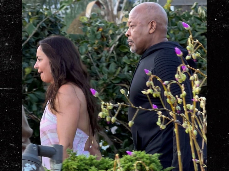 Dr. Dre and mystery woman ACKGRID
