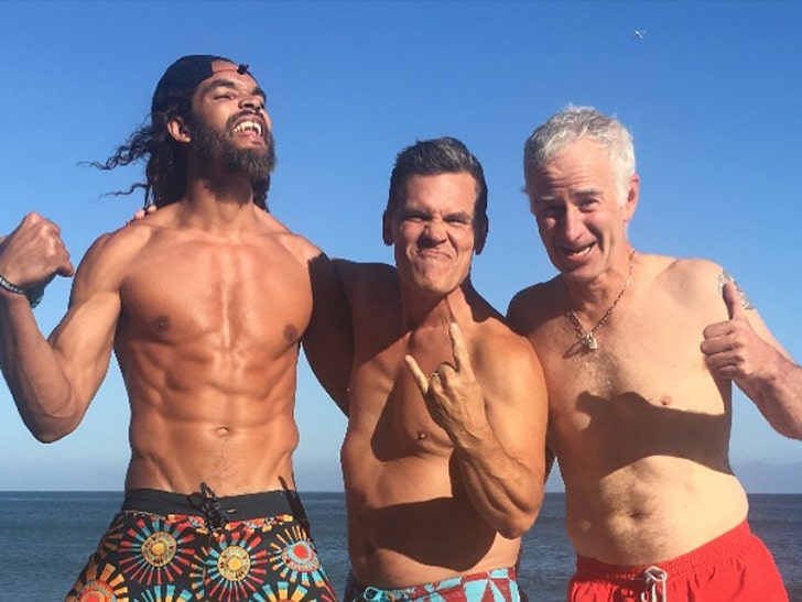 Joakim Noah, Josh Brolin, and John McEnroe on the beach on vacation