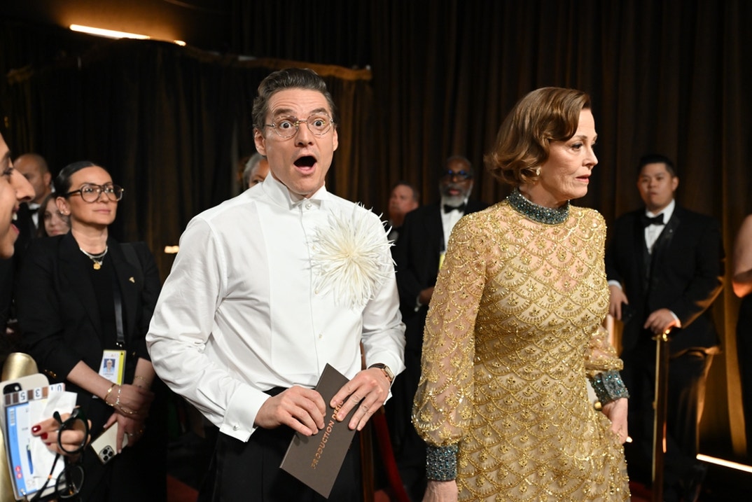 Pedro Pascal and Sigourney Weaver pose backstage