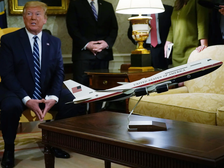 trump with model plane