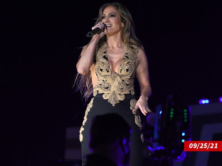 Jennifer Lopez Struts her Stuff in Tight-Fitting Gown on Video