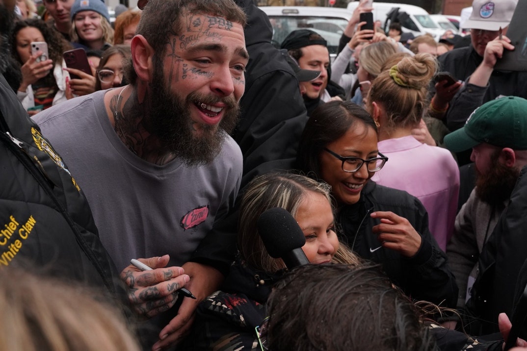 Post Malone cuts ribbon on custom-designed Raising Cane's restaurant