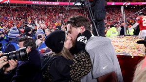 taylor swift and travis kelce kiss getty 1