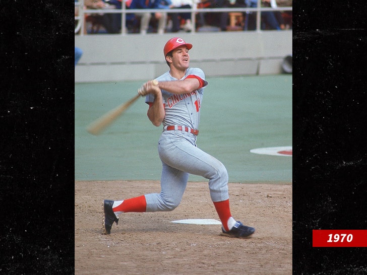 Pete Rose at the plate, in a gray uniform, at the end of a left-handed swing.