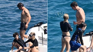 Orlando Bloom goes snorkeling with son Flynn and mystery woman LAUNCH