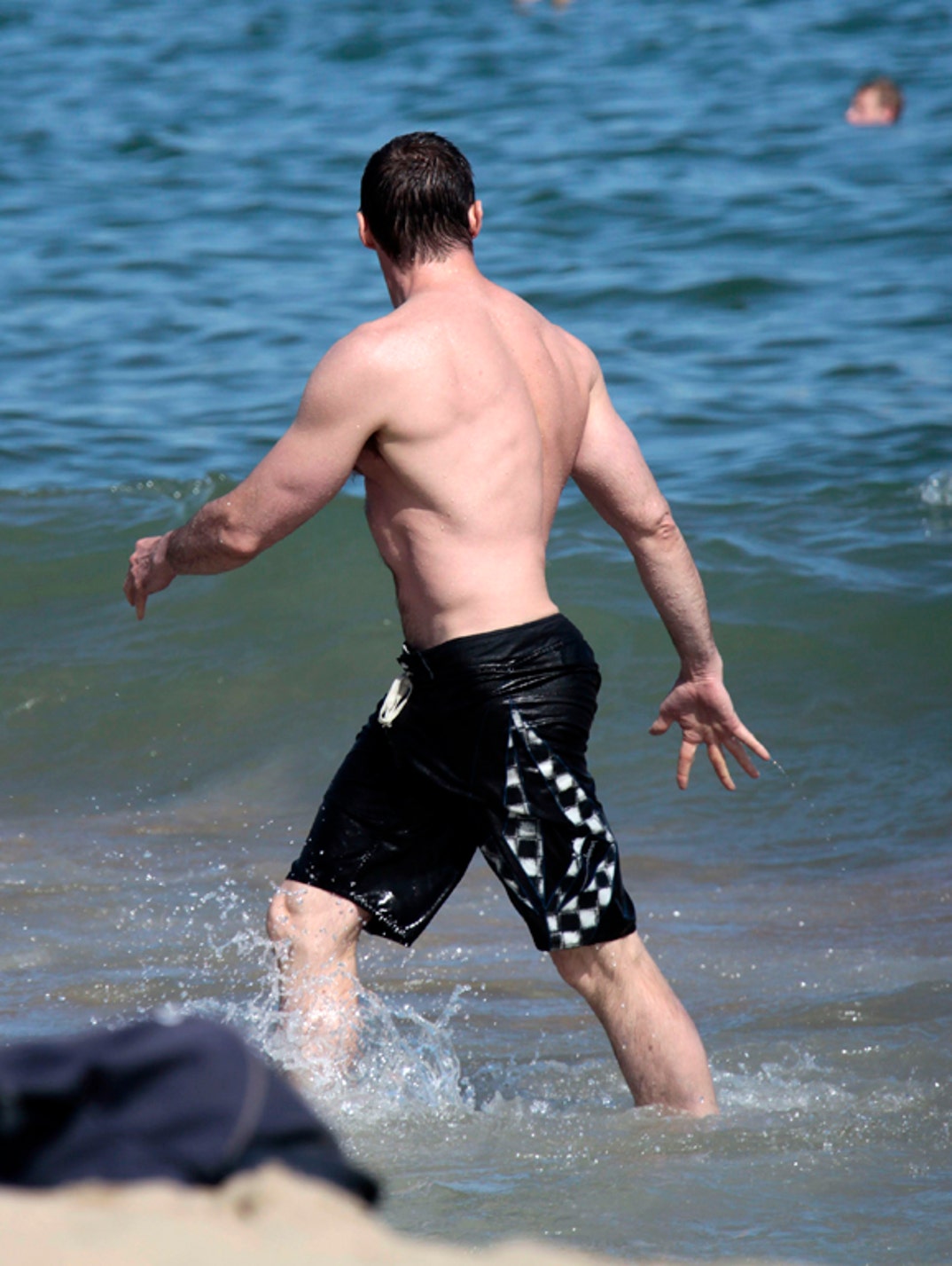 Hugh Jackman Goes Topless to Barcelona Beach