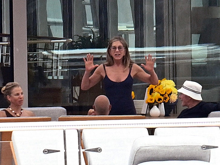 Jennifer Aniston Seems to Confirm Romance in PDA-Packed Pics with Jim Curtis
