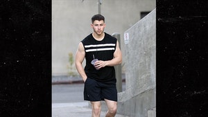 Nick Jonas Leaves Gym and Shows Off Guns