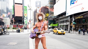 Naked Cowboy Busks on Empty Streets with Face Mask