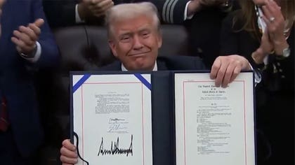 111325_donald_trump_signs_bill_kal