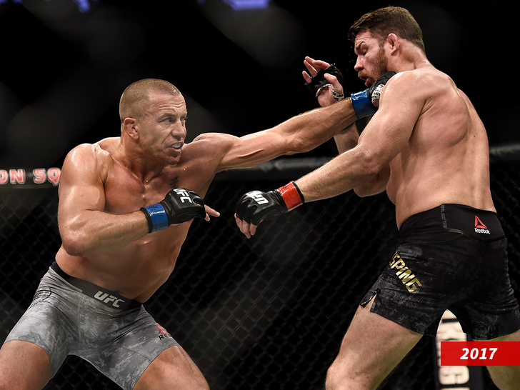 ) Georges St-Pierre of Canada punches Michael Bisping