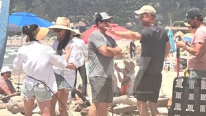 0801-Meghan-Markle-Harry-On-Beach-PRIMARY