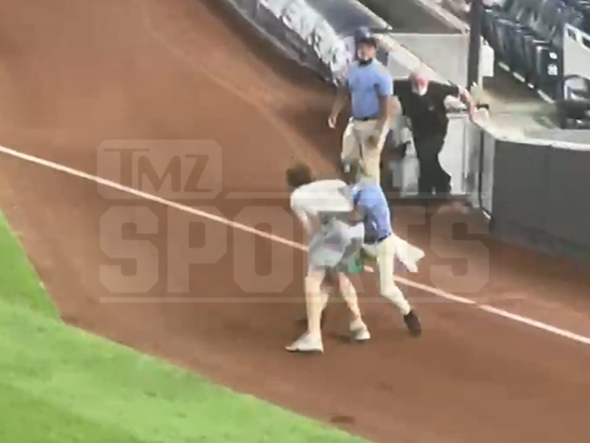 Yankee Stadium, 09/16/09: security guy searches a woman's …