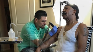 Drake's Dad Inks Monster Tattoo of Drake's Face on His Arm