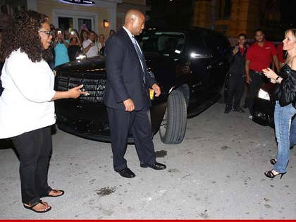 1027-oprah-driver-foot-getty