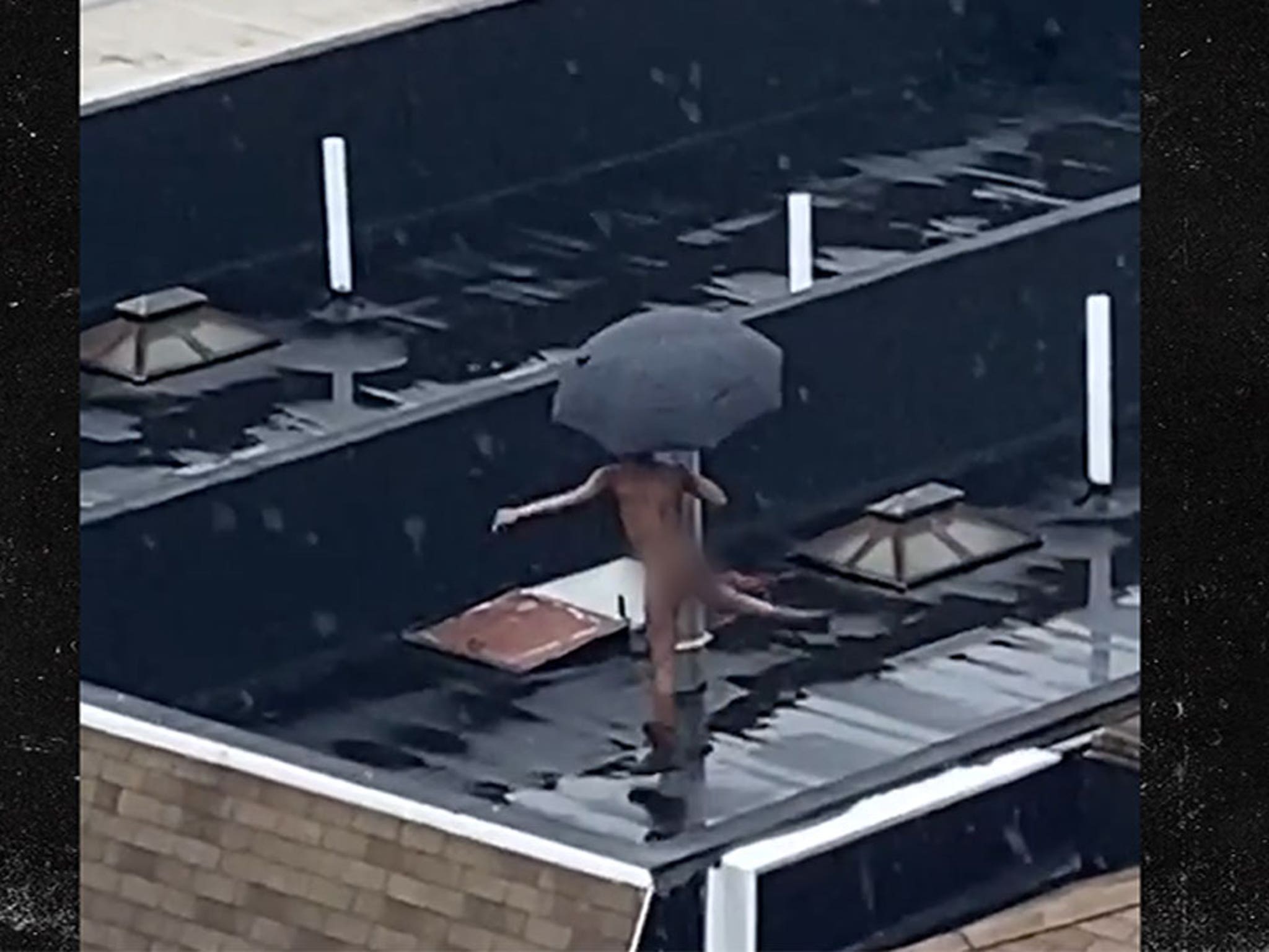 NYC Dweller Does Naked Rooftop Dancing in the Rain, Umbrella Included