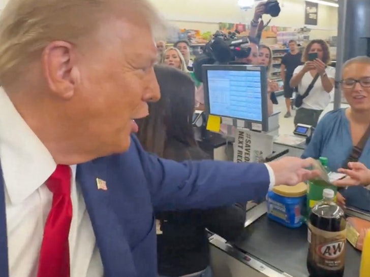 092424 donald trump hands woman 100 bill