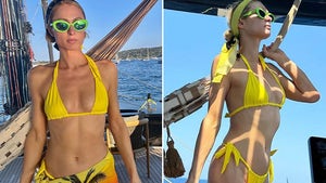 Paris Hilton Sliving In A Yellow Bikini