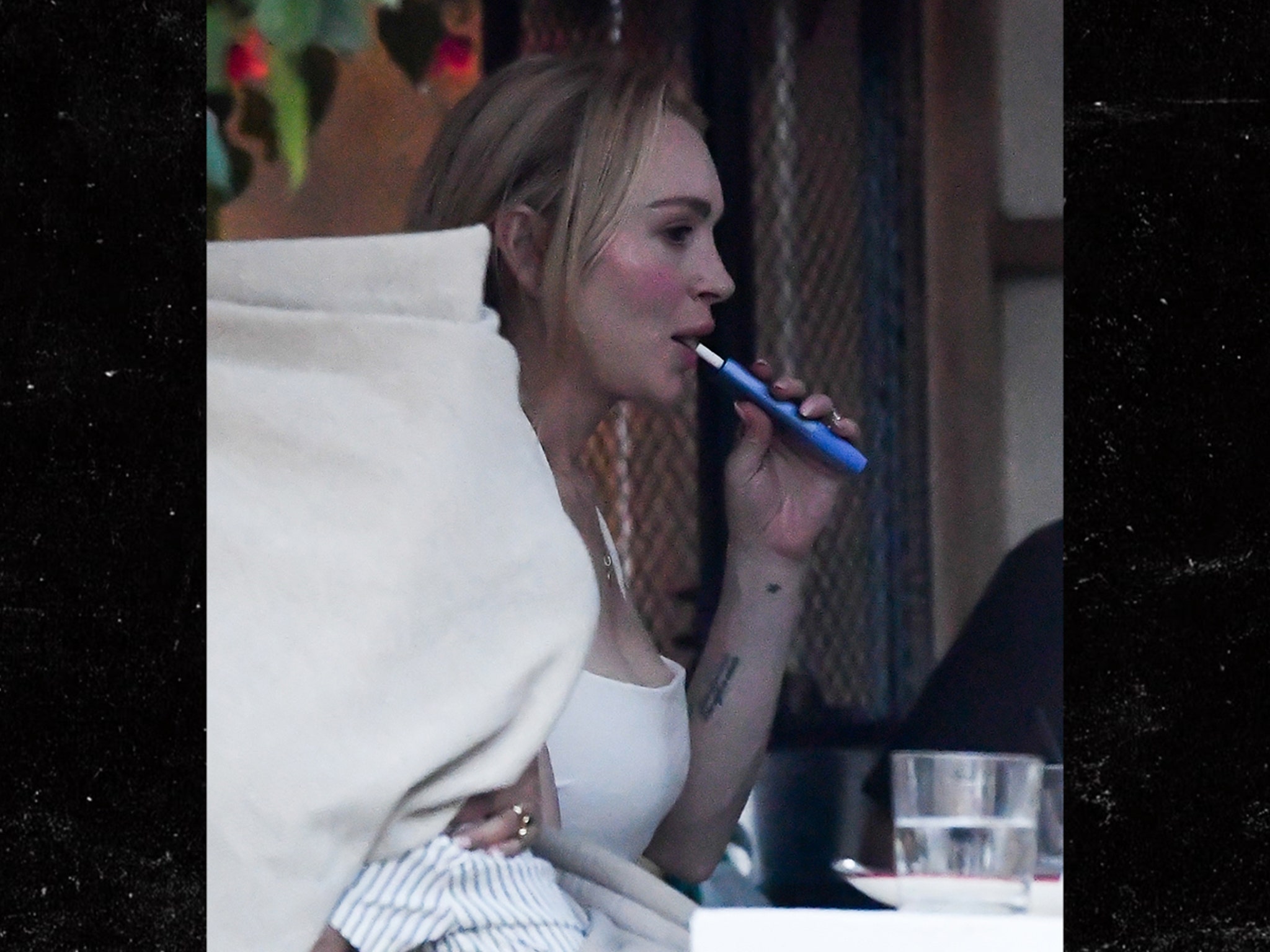 Lindsay Lohan Vapes, Eats Ice Cream in Miami With Husband, Son