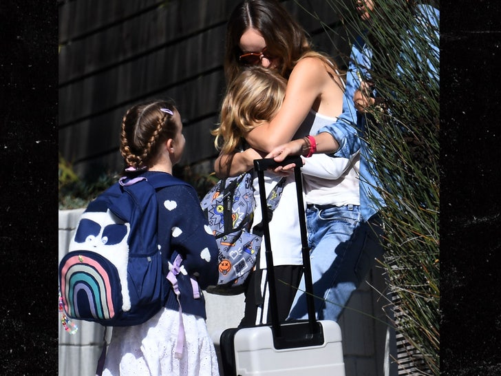 Olivia Wilde gives her two children Otis and Daisy hugs