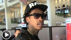 Wiz Khalifa -- Gives High Sign at the Airport