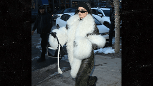 Kylie Jenner Wears Seemingly Real Fur Scarf On Aspen Trip with Kendall