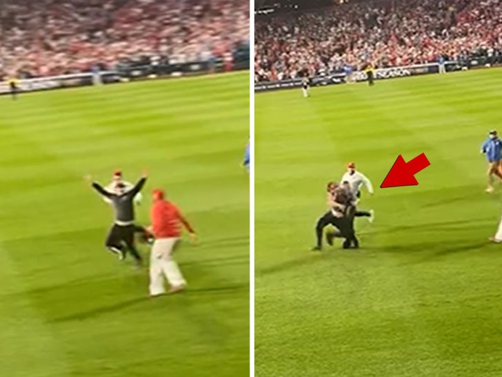 WATCH: Fan tackled hard by security guard on field during Phillies game