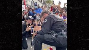 Cop Takes Knee to Crowd's Approval During George Floyd Protest