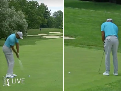 0716-tiger-woods-golfing-01