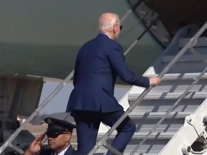 Joe Biden walking up the stairs on Air Force One.