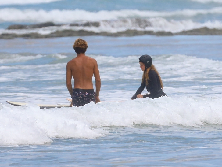 shakira surfboarding in costa rica
