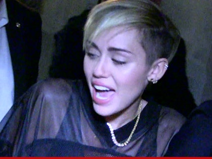 0523-miley-cyrus-tmz-01