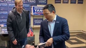 Andrew Yang Shoots Whipped Cream Into Mouths of Kneeling Supporter