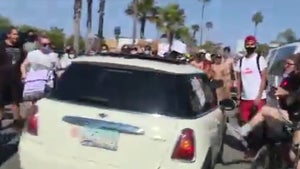 Car Speeds Through Crowd of Newport Beach Protesters, Driver Arrested