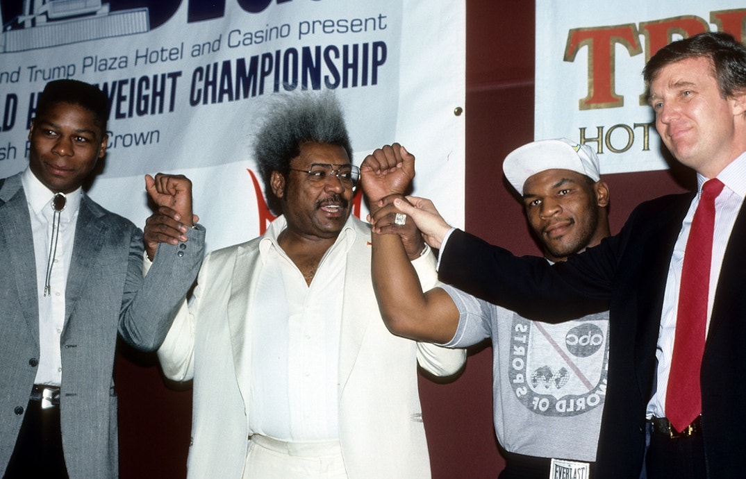 Tyrell Biggs, Promoter Don King, Mike Tyson and Donald Trump pose during the press conference to promote their upcoming fight in New York.