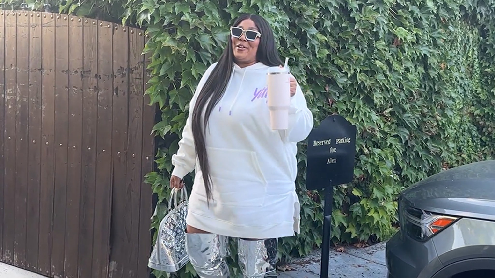 Lizzo puts on a busty display in a colourful crochet top and distressed  jeans for dinner in LA