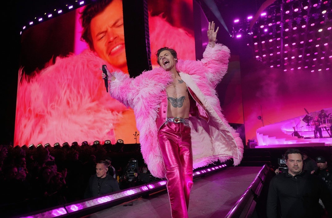 2022: Harry Styles performs in a hot pink attire