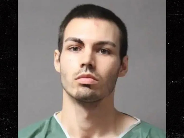 Hunter Nadeau is seen while posing for a mugshot. He's wearing a green jumpsuit.