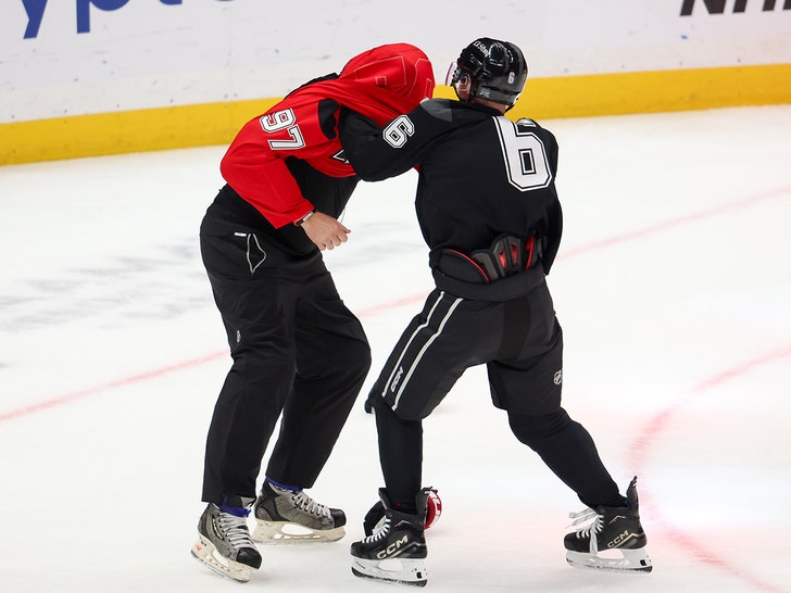 Justin Bieber Playfully Brawls With Jeremy Roenick At Charity Hockey Game