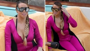 Mariah Carey Wearing A Pink Swimsuit On a Boat