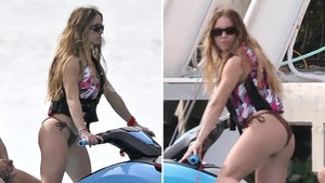 Sydney Sweeney In A Brown Bikini Riding a Jet Ski