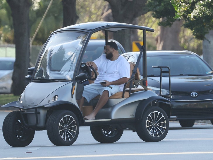 dj khaled in gold cart pulled over 3