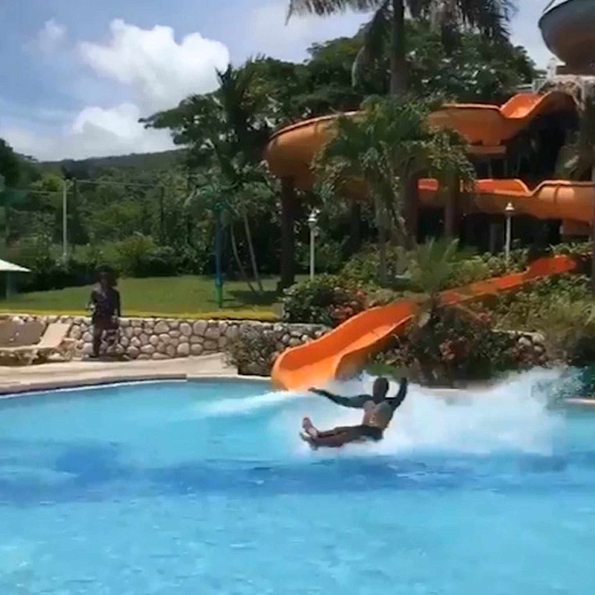 Water Slide Guy Sticks Landing by Gliding Over Water!